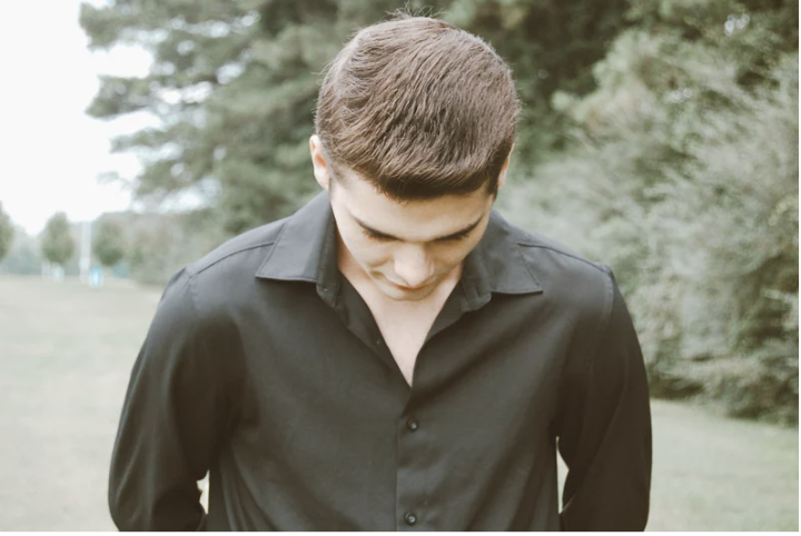 standing man, looking down